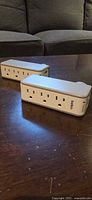 Two Belkin surge protector wall taps front view showing AC outlets