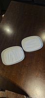 Two Bumkins rectangular marble-pattern silicone suction plates on tabletop