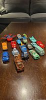 All 18 die-cast Disney Pixar Cars characters grouped on table