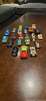 All 22 Hot Wheels cars lined on table