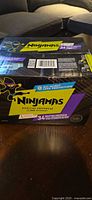Front angled view of sealed Ninjamas 34-count size L box