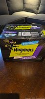 Front view of sealed Ninjamas box showing brand, size large, 34 count