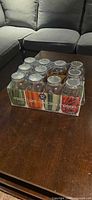 Front view of boxed mason jars showing 11 clear jars in cardboard tray