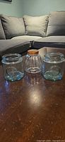 Set of three glass jars on table