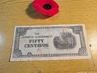 Obverse of 50 centavos note showing vignette, denomination, red P1 overprint