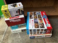 Stack showing all puzzle boxes and RollUp mat