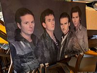 Front view of full mounted poster showing image of four Ultravox members