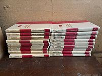All 21 volumes stacked spine-out showing uniform design and wear
