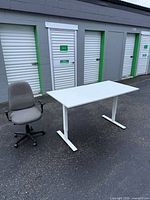 Full view of desk front with white laminate top and T-legs