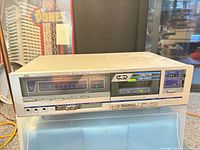 Front view of JVC KD-V33 cassette deck showing full control panel and display