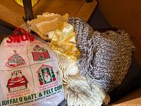 Bag of Buffalo Batt craft batting with surrounding textiles