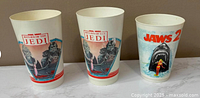 Front view of all three cups displaying movie graphics
