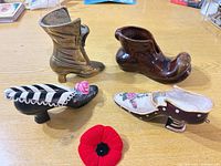 All four miniature shoe figurines on tabletop