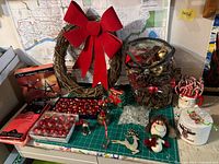 All items on worktable including wreath, ornaments, accessories