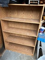Front view of four-tier laminate shelf unit