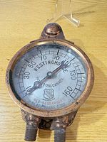 Front view of Westinghouse pressure gauge showing full dial and dual ports