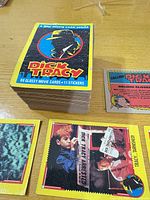 stack of Dick Tracy cards and open cards on table