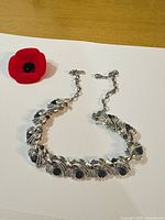 full view of choker laid flat showing design and clasp