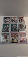 Grid view of nine sleeved hockey goalie cards