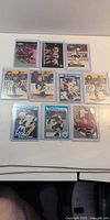 Group shot of all 10 hockey cards in sleeves