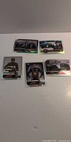 All five Formula 1 trading cards laid out