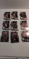 Nine UFC Donruss cards laid out on white background