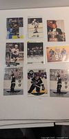 Nine Wayne Gretzky hockey cards laid out on white background
