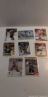 All eight hockey trading cards laid out to show fronts