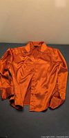 Front view of orange Haggar button-up shirt