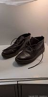 Pair of brown leather chukka boots side view