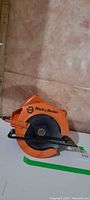 Left profile of Black & Decker circular saw showing housing, blade guard and base plate
