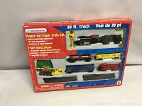 Original boxed set showing six cars, track, and accessories inside packaging