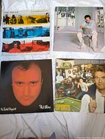 Group shot showing all four album jackets