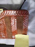 Front view showing faux snakeskin and suede panel design