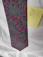 Front view of full tie displaying paisley pattern