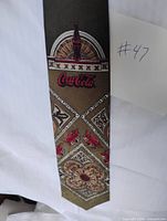 Full view of the Coca-Cola necktie showing overall design