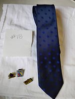 Full view of tie and three pins