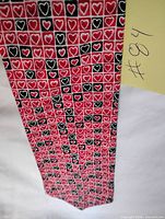 Full view of necktie showing heart pattern