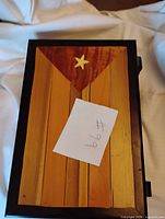 Closed humidor showing Cuban flag motif on lid