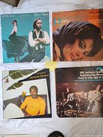 Group image showing all four LP covers