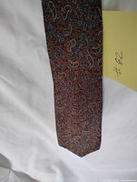 Full view of Lanvin brown paisley tie