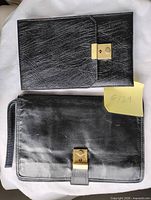 both clutches front view showing size difference and clasps