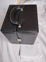 Closed black leather bar case with handle