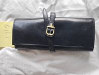 Front view showing leather surface and gold-tone buckle