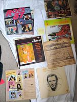 Overview of eight LP album covers laid out on sheet