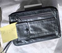 Overall view of black wristlet with front pockets