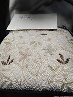 Front view showing beadwork pattern and overall condition