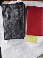 front view of both wallets, size comparison
