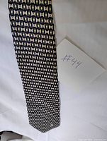 Full length view of Versace tie showing pattern
