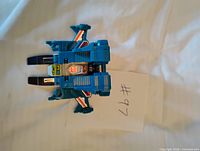 Top view of blue Topspin figure with cockpit and wings visible